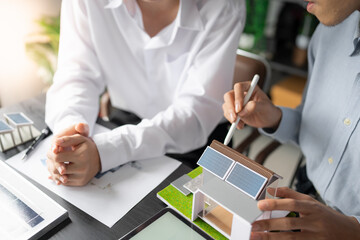 Solar panels green energy Business man working green eco friendly office business creative idea Planing Bio economy for business eco friendly professional Engineer sustainable electricity.