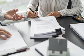 Business people signing contract making deal with real estate agent Concept for consultant home...