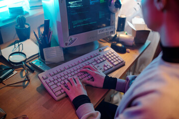 Female Web Developer Writing Code on Retro Computer
