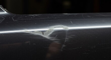 Closeup dark gray metallic surface showing damage. AI Generated