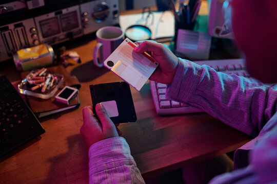 Unrecognizable Man Examining Floppy Disk