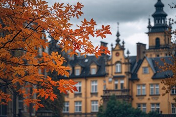 Naklejka premium Autumn Leaves Near Historic Buildings on Cloudy Afternoon