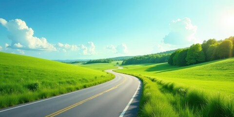 Fototapeta premium Serene Winding Road Through Lush Green Meadows Under a Sunny Sky