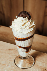 close-up photo of black cookie milkshake in Colombian coffee shop