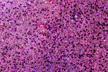 Fototapeta premium Full frame macro abstract texture background of sparkling multicolor pink glitter with copy space