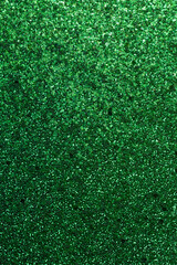 Fototapeta premium Full frame macro abstract texture background of sparkling green color glitter with copy space