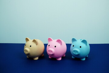 Piggy Bank Saving with space copy on blue background