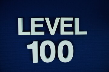Level 100 Level One hundred alphabet letters on navy blue background