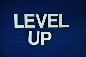 Level Up alphabet letters on navy blue background