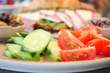 Delicious salad and sandwich platter on a dining table