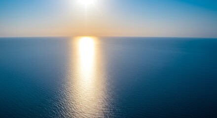 Obraz premium Golden Hour Sea Glow: Serene Sunset Reflection AI Generated