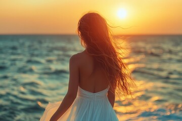 Golden Sunset Serenity: A woman, bathed in the warm glow of the sunset, gazes out at the vast ocean, her flowing hair dancing in the gentle breeze.