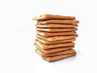 Pile of square cracker biscuit isolated on white background 