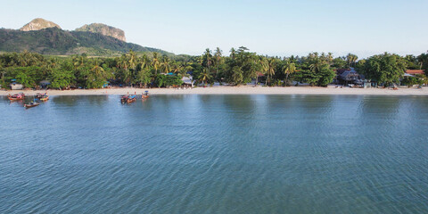 Aerial view of Andaman sea with the white beach and long tail boat