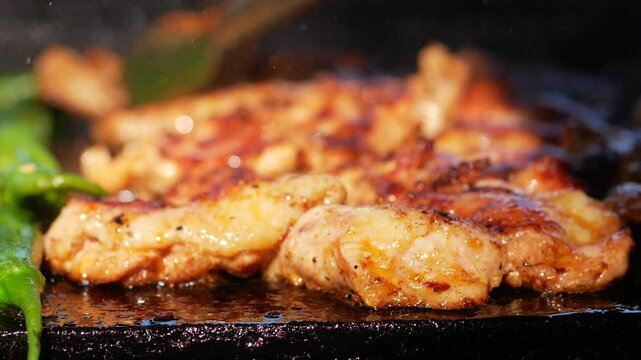 Sizzling chicken grilled to perfection outdoors at a summer gathering