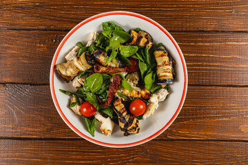 Delicious grilled vegetable and chicken salad served in a rustic bowl