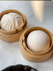 Pyanse steamed bun in a Bamboo steamer, korean street food. 
