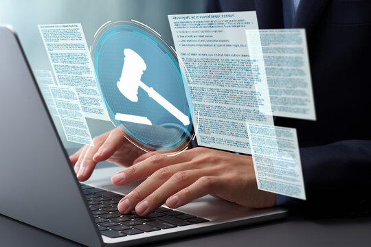 Legal documents and gavel hammer icon. Lawyer reviewing and preparing legal documents for court cases. Hands typing on laptop computer keyboard at desk in office.