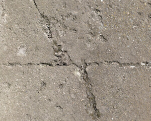 Background of destroyed concrete path, gray concrete, concrete texture, close-up. Natural photo. Old concrete slab