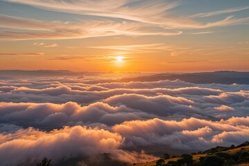 Fototapeta premium Stunning Golden Sunrise Above Soft Clouds in a Beautiful Landscape