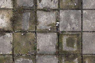 Background of destroyed concrete path, gray concrete, concrete texture, close-up. Natural photo. Old concrete slab