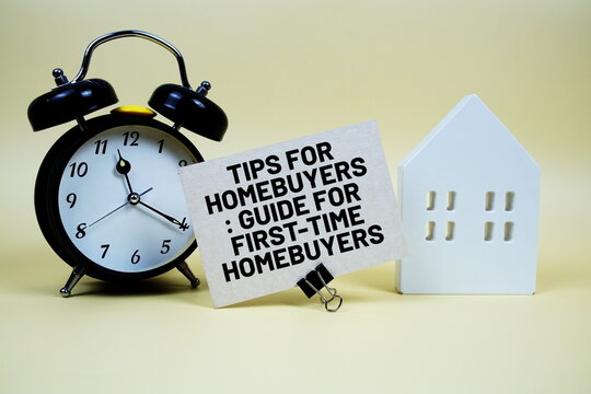 Tips For Homebuyers: Guide For First-time Homebuyers text with house model and alarm clock on yellow background