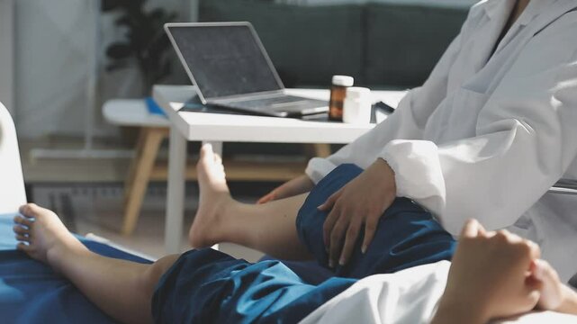physiotherapist massaging the knee of a patient. rehabilitation and recovery after physical knee injuries.Rehabilitation physiotherapy. Sportsman Recovering from Injury, Undergoing Rehabilitation.