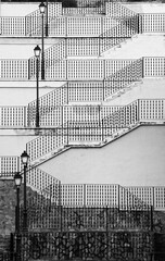 Inclined staircase with vintage lampposts in Spain