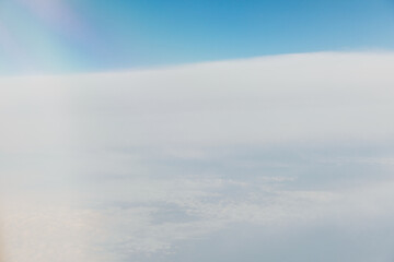Beautiful landscape in the sky with clouds from the window of an airplane