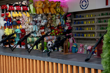 Fototapeta premium Toys and weapons in the prize shooting range