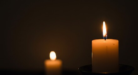 A Single Candlelight Illuminating the Darkness: A Symbol of Hope and Remembrance