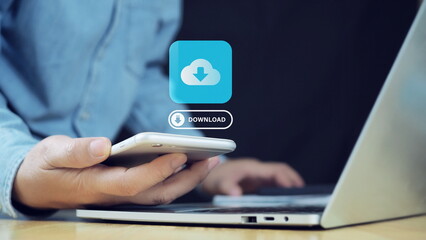 Businessman download files or install software on laptop computer and smartphone, cloud storage technology, data backup, cyber security, document downloading. Transfer files data concept.