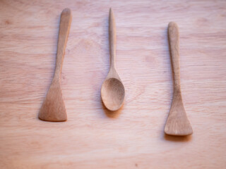 wooden spoons on wooden background