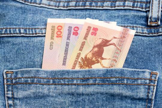 Old Belarusian ruble in the pocket of blue jeans
