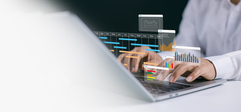 Planning software, Project management tool and work schedule concept, Businessman use laptop to manager working projects and update task with gantt chart schedule to business plan and progress.