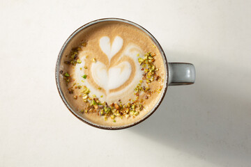 A top down view of a coffee drink with latte art.