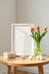 A blank white frame rests on a light wooden table, accompanied by a vase of springtime tulips and pastel-colored eggs, presenting a peaceful and serene atmosphere.