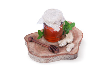 Organic Honey Jar with Fresh Ginger, Mint Leaves, and Wooden Honey Dipper on Rustic Wooden Board – A Natural Remedy for Health and Wellness