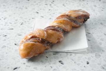 A view of a cinnamon twist donut.