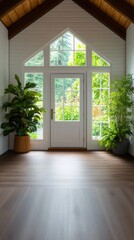 A newly renovated sunroom boasts gleaming hardwood floors, a bright white door, and large showcasing a lush green garden view, creating a serene and inviting atmosphere.