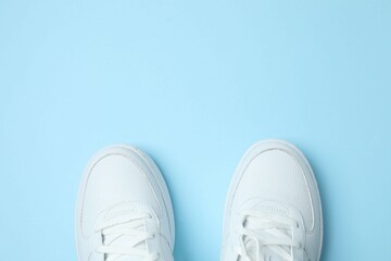 White sneakers on a colored background