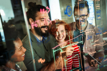 Group of business people and software developers working as a team in office