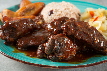 A closeup view of a jerk chicken wings entree.