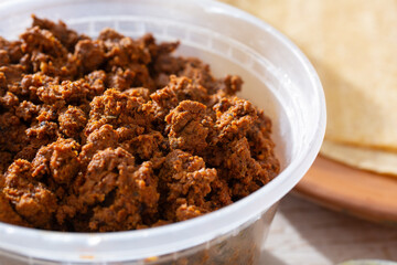 A closeup view of a cup of turkey chorizo.