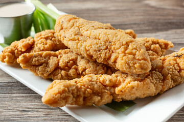 A view of a plate of chicken tenders.
