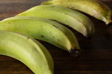 A closeup view of a group of green plantains.