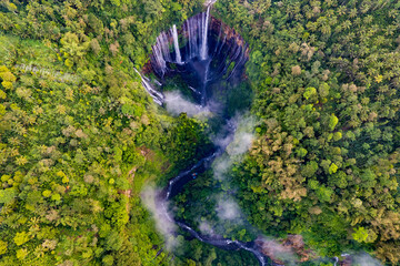 Aerial top view from above of Tumpak Sewu waterfall in Malang, East Java, Indonesia