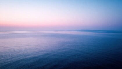 Obraz premium Peaceful Sunrise Over the Calm Sea