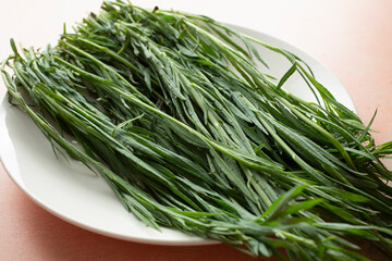 A closeup view of a pile of pipicha on a plate.