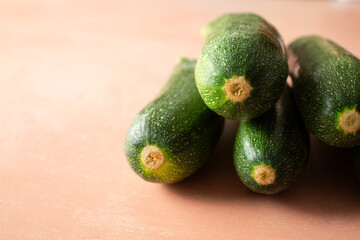 A view of a pile of zucchini.